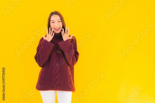 Portrait beautiful young asian woman smile on yellow isolated background