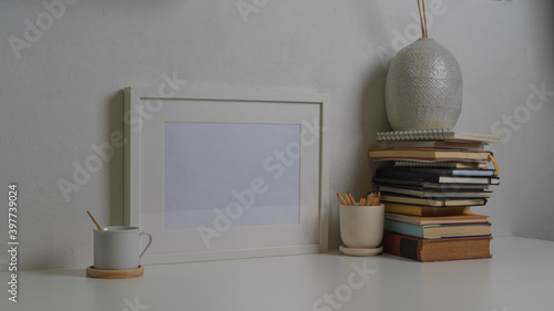 Workspace with tablet  laptop  books and decorations in home office room