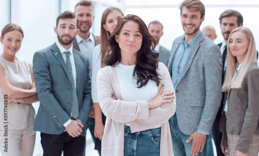 Fototapeta premium confident young woman standing in front of the business team.