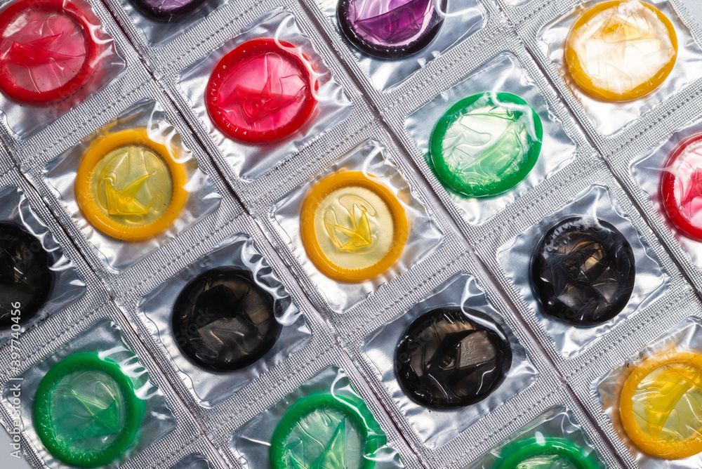 Colorful condoms background.