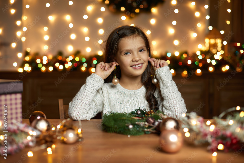 happy smiling cute little child girl holding christmas ball at home. happy smiling cute little child girl holding christmas ball at home.