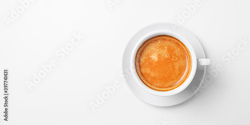 Coffee espresso isolated on white. Served in a white cup with a spoon. Coffee time  close up photo