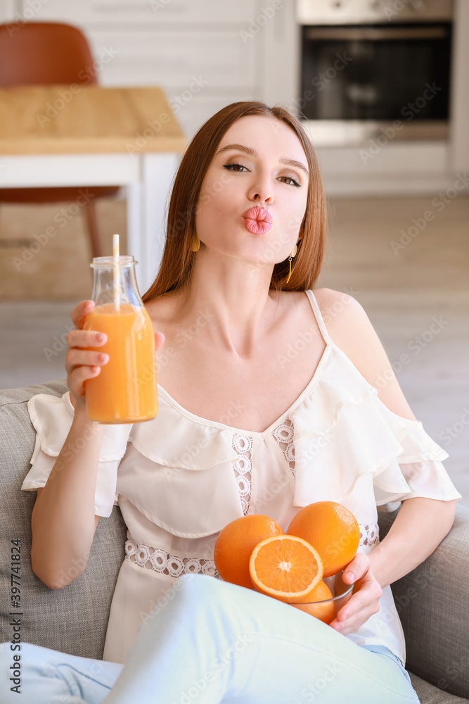 Beautiful young woman drinking orange juice at home Beautiful young woman drinking orange juice at home