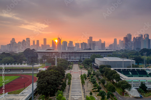 Beautiful Senayan Stadium with cityscape at sunset