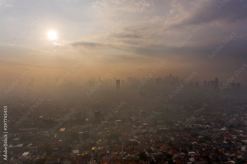 Beautiful Jakarta city with dense housing at sunset