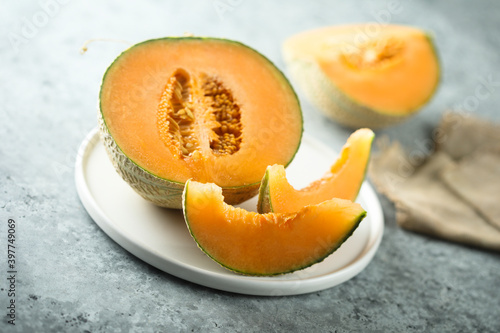 Fresh honey melon on a white plate