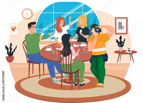 Friends are having rest at home. People spend time in different ways with board games on the table. Young characters have a great time together. Photographer takes pictures of people playing