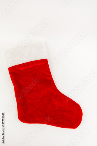 Red Santa stocking isolated on white background. Christmas or holiday concept