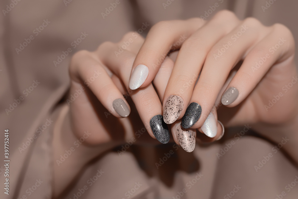 Female Hands With Beige Nail Design. Glitter Gray Nail Polish Manicure.  Woman Hands On Brown Fabric Background Stock Photo | Adobe Stock