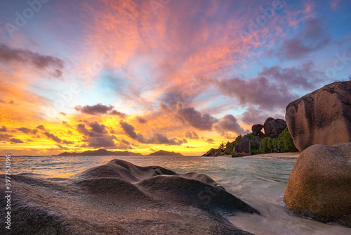sunset at tropical beach in paradise on anse source d'argent on ladigue, seychelles © Christian B.