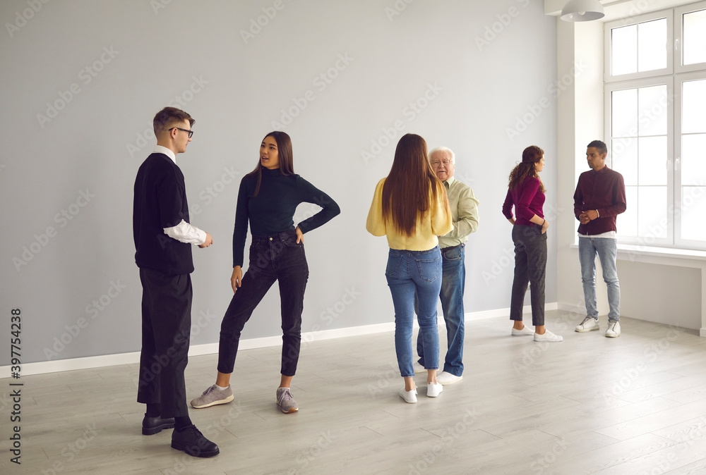 Fototapeta premium People standing in pairs and getting to know each other in group therapy session
