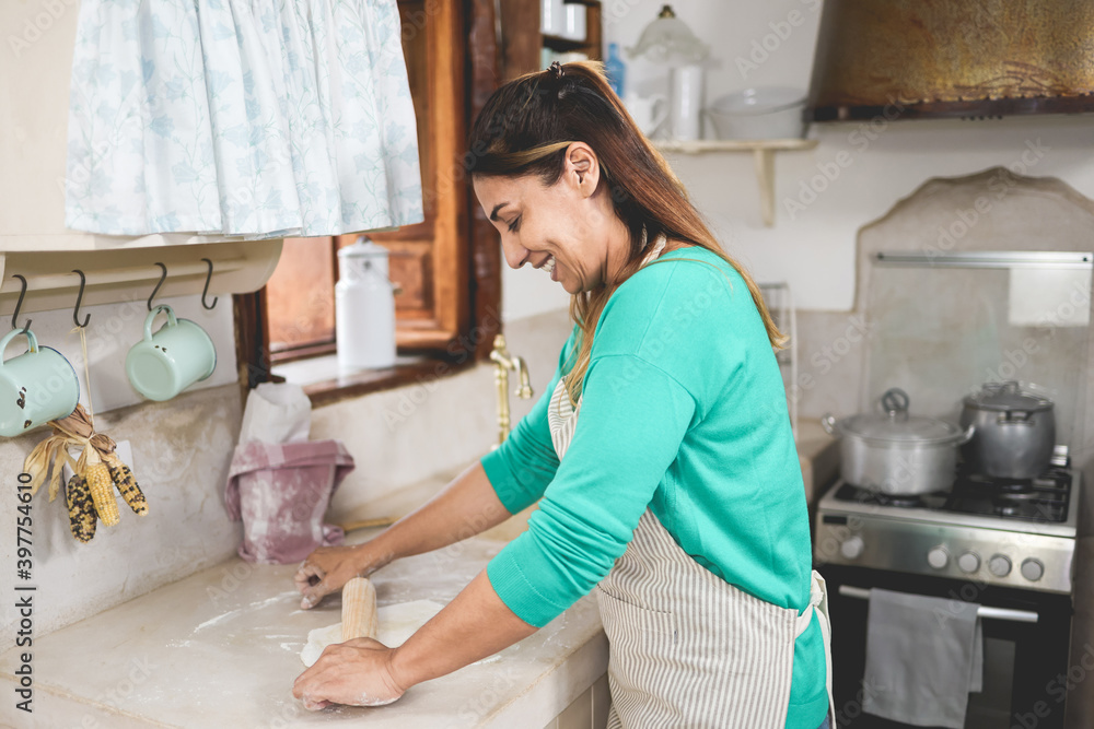 Happy woman preparing fajitas wrap at home inside vintage kitchen - Homemade food and cooking concept - Focus on ear Happy woman preparing fajitas wrap at home inside vintage kitchen - Homemade food and cooking concept - Focus on ear