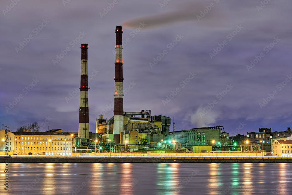 Factory smoking chimneys on Neva River. Russia, Saint Petersburg