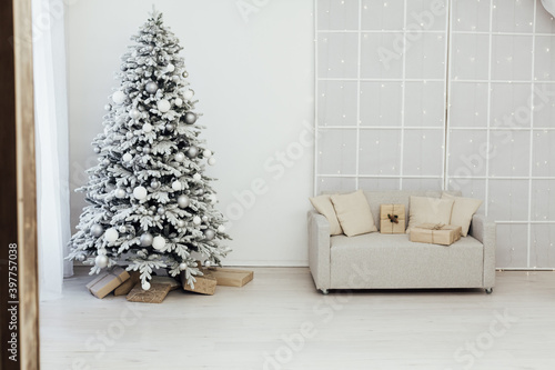 Christmas tree with gifts for the new year interior decor