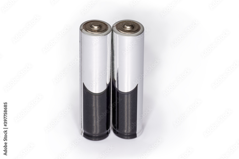 Alkaline AAA batteries on a white background close-up Alkaline AAA batteries on a white background close-up