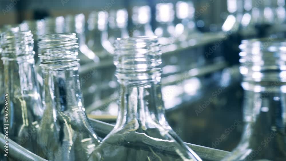 Factory conveyor with multiple glass bottles Factory conveyor with multiple glass bottles