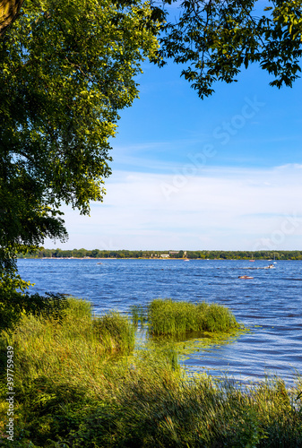 Panoramic view of Zegrzynskie Reservoir Lake and Narew river with reed and water vegetation coastline in Zegrze resort town in Mazovia region, near Warsaw, Poland