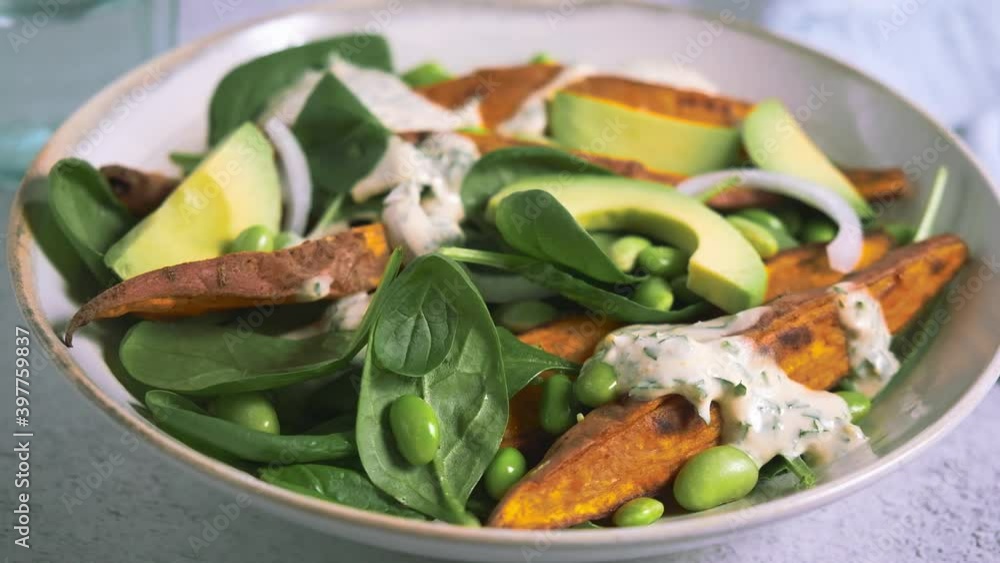 Vegan food concept. Baked sweet potato salad with avocado and edamame. Vegan food concept. Baked sweet potato salad with avocado and edamame.