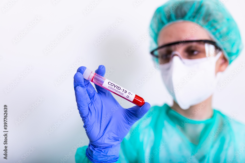 coronavirus covid 19 infected blood sample in sample tube in hand of scientist with biohazard protection clothing in coronavirus covid 19 reseach laboratory, coronavirus covid-19 vaccine research coronavirus covid 19 infected blood sample in sample tube in hand of scientist with biohazard protection clothing in coronavirus covid 19 reseach laboratory, coronavirus covid-19 vaccine research
