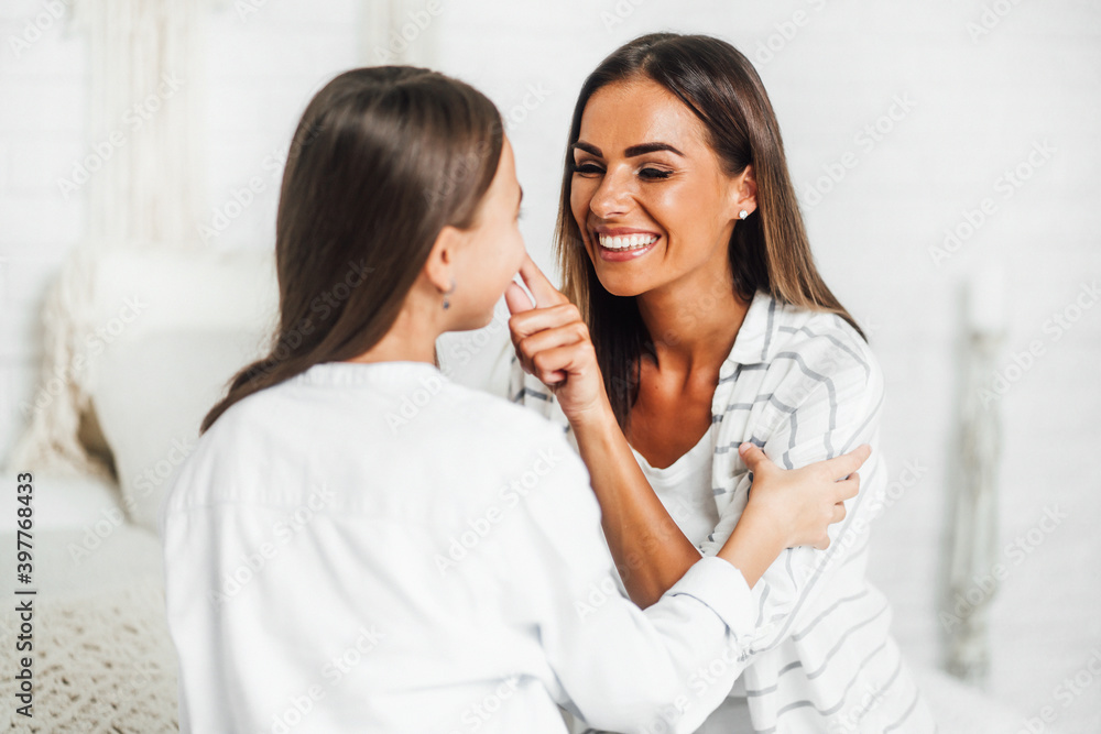 Happy mother playing with her child, spending time happily together Happy mother playing with her child, spending time happily together