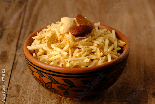 Indian style deep fried snacks falahari chivda- chivda or mixture namkeen with dry fruits.