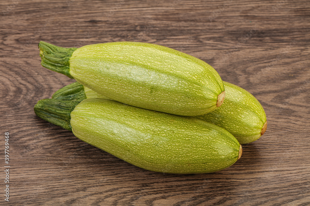 Young tasty zucchini over board Young tasty zucchini over board