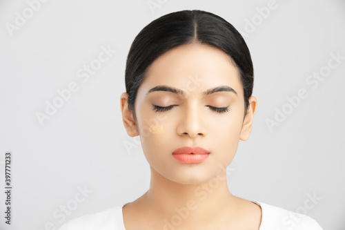 Photography Beautiful indian girl perfect face with closed eyes on white