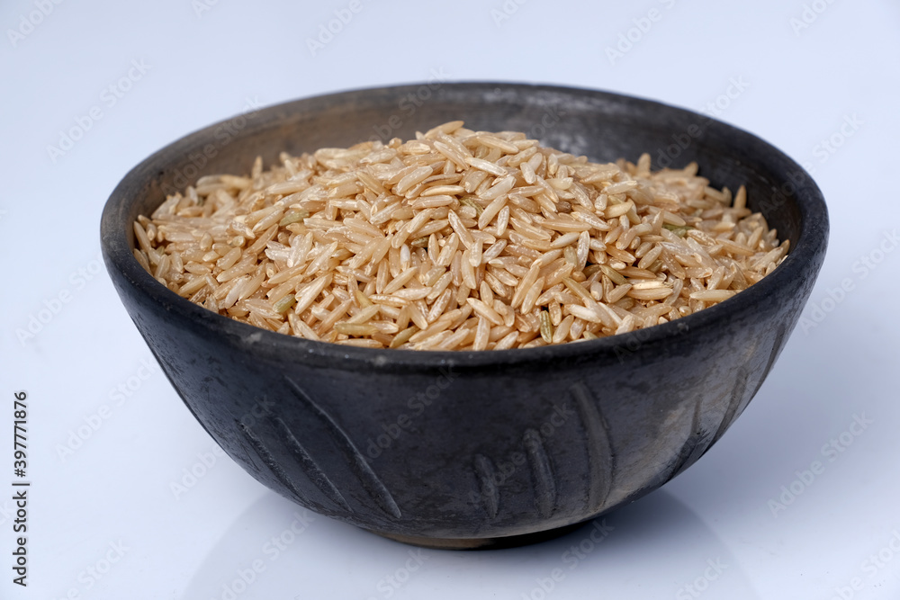 Raw brown rice in a bowl Raw brown rice in a bowl