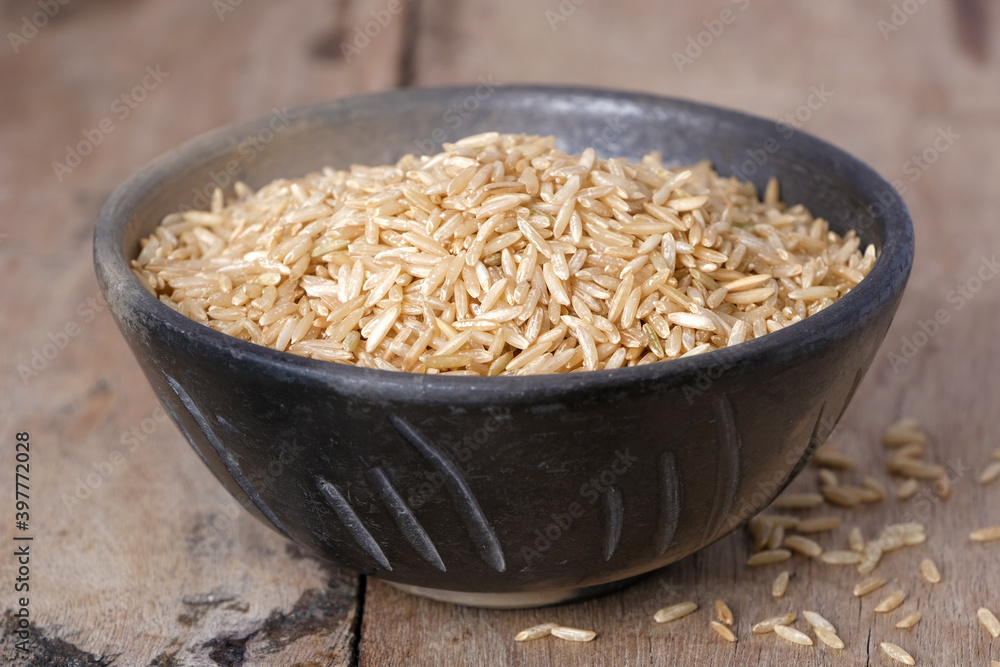 Raw brown rice in a bowl Raw brown rice in a bowl