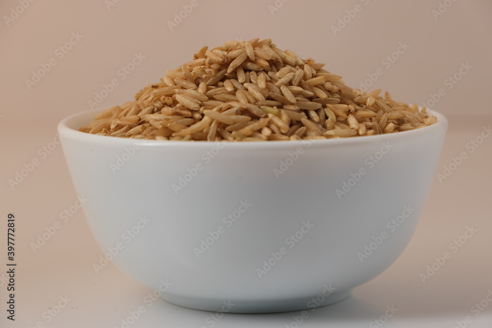 Raw brown rice in a bowl Raw brown rice in a bowl