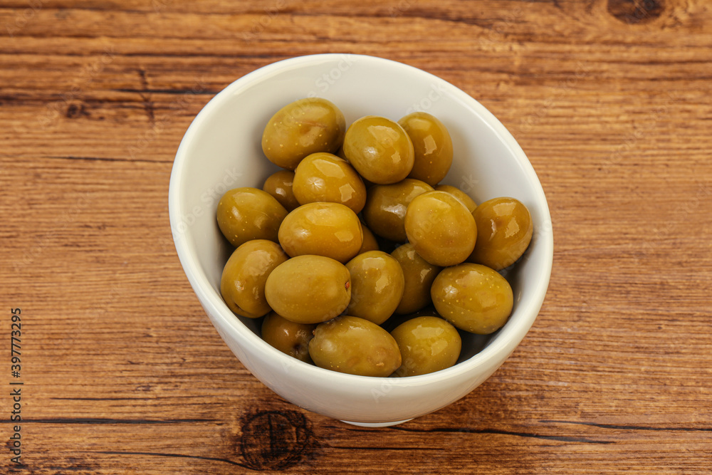 Green pickled olives in the bowl