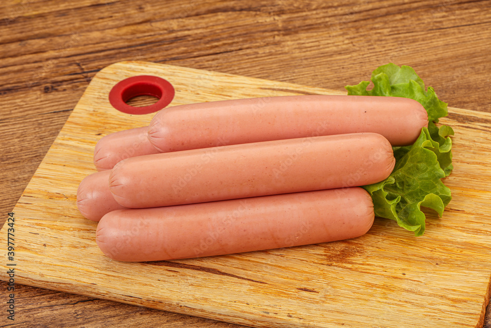 Tasty meat sausages over board Tasty meat sausages over board