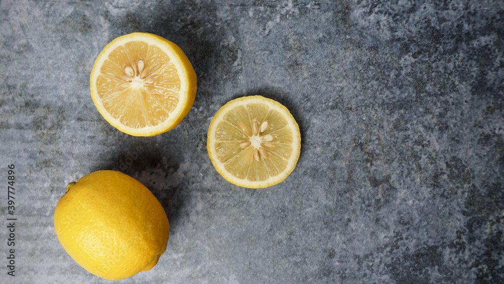 Yellow Lemons on gray concrete table. Yellow Lemons on gray concrete table.