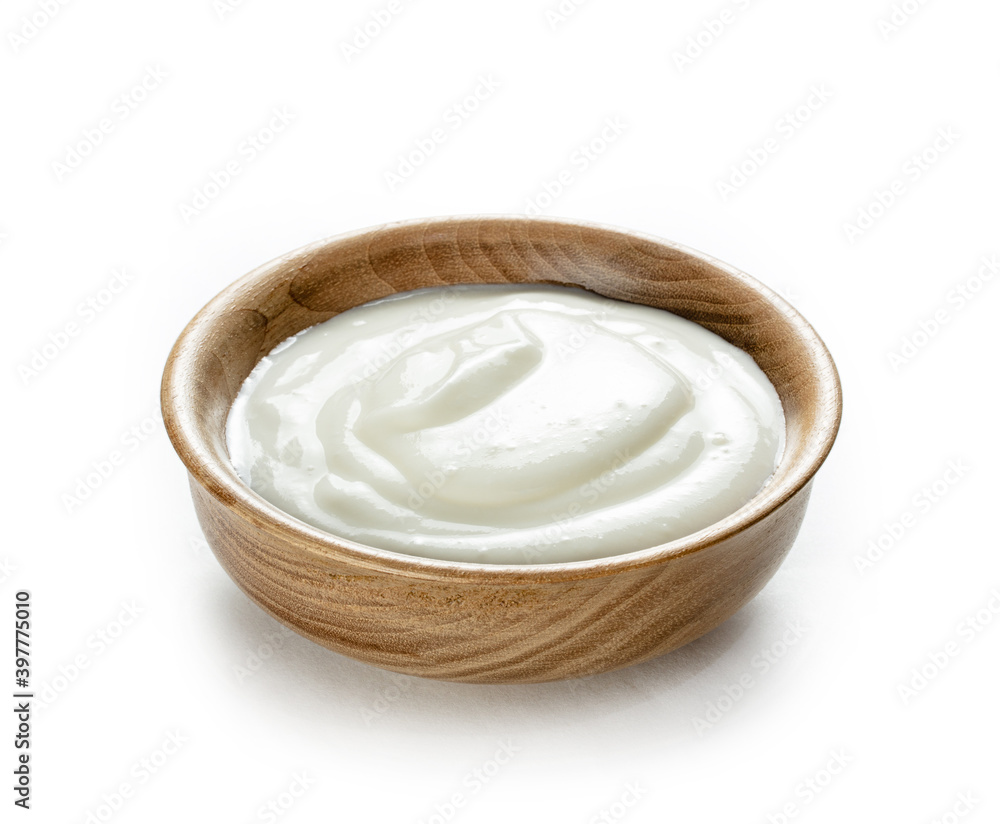 cream sour in small wooden bowl isolated white background cream sour in small wooden bowl isolated white background