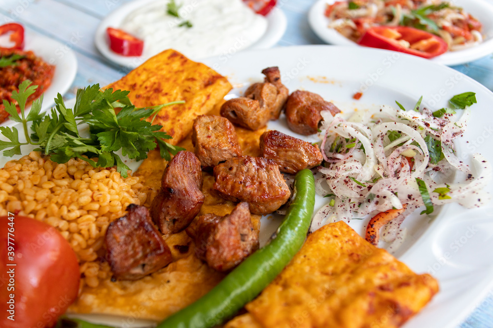 meat shish kebab in a plate with appetizers meat shish kebab in a plate with appetizers