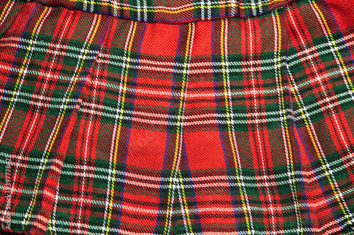 Red checkered women's mini skirt. Close up