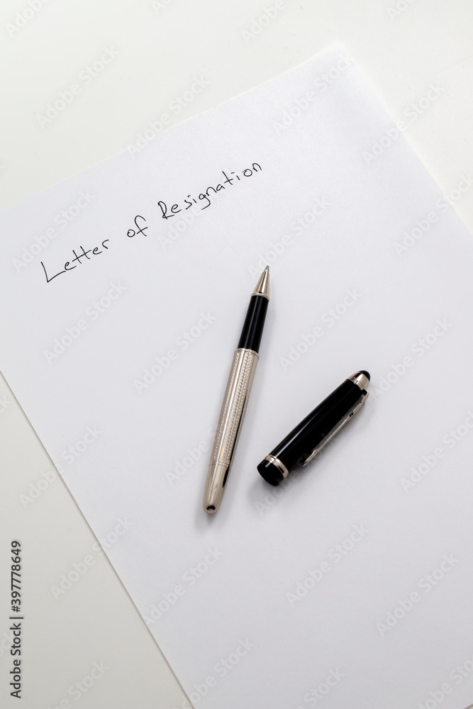 employee writing resignation letter on a blank paper employee writing resignation letter on a blank paper