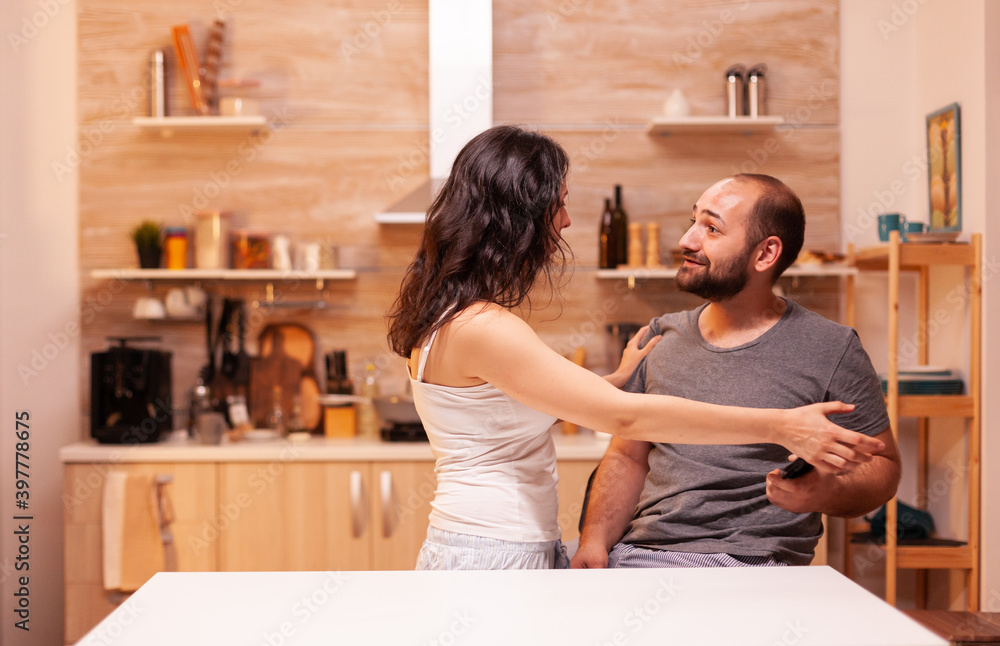 Jealous woman checking man's phone. Suspicious woman with trust issues, cheated, angry, frustrated and irritated, snatching husband's smartphone for fidelity verification. Jealous woman checking man's phone. Suspicious woman with trust issues, cheated, angry, frustrated and irritated, snatching husband's smartphone for fidelity verification.
