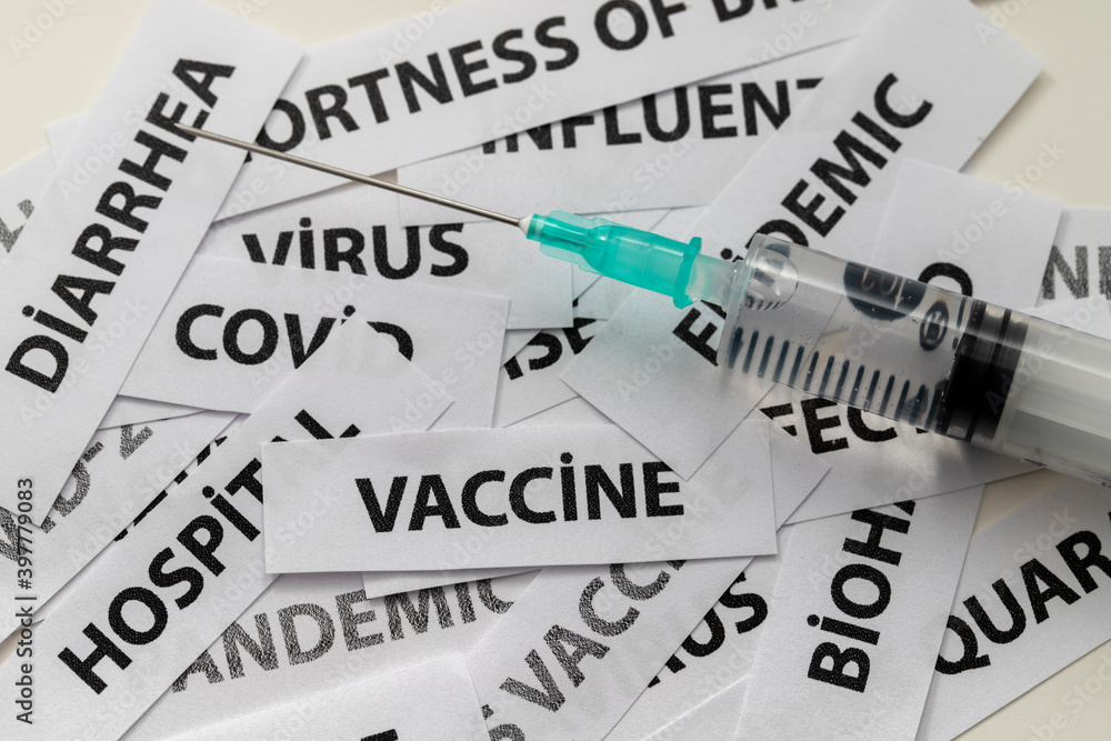 coronavirus-related labels and needle with vaccine coronavirus-related labels and needle with vaccine