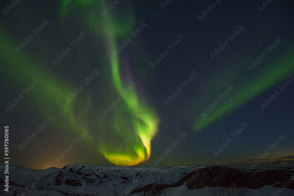 Beautiful northern lights in winter over the tunra and hills.