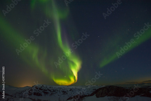 Beautiful northern lights in winter over the tunra and hills.