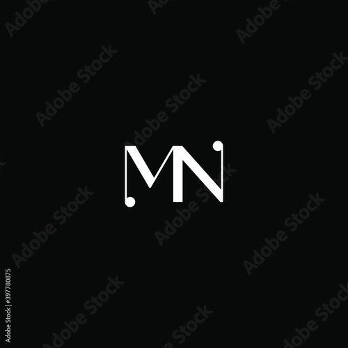 M N letter logo creative design on black color background. mn monogram