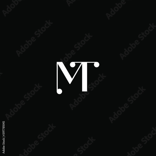 M T letter logo creative design on black color background. mt monogram photo