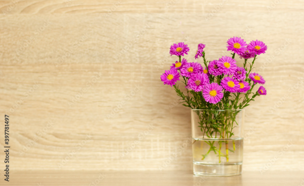 small pink flowers in a vase