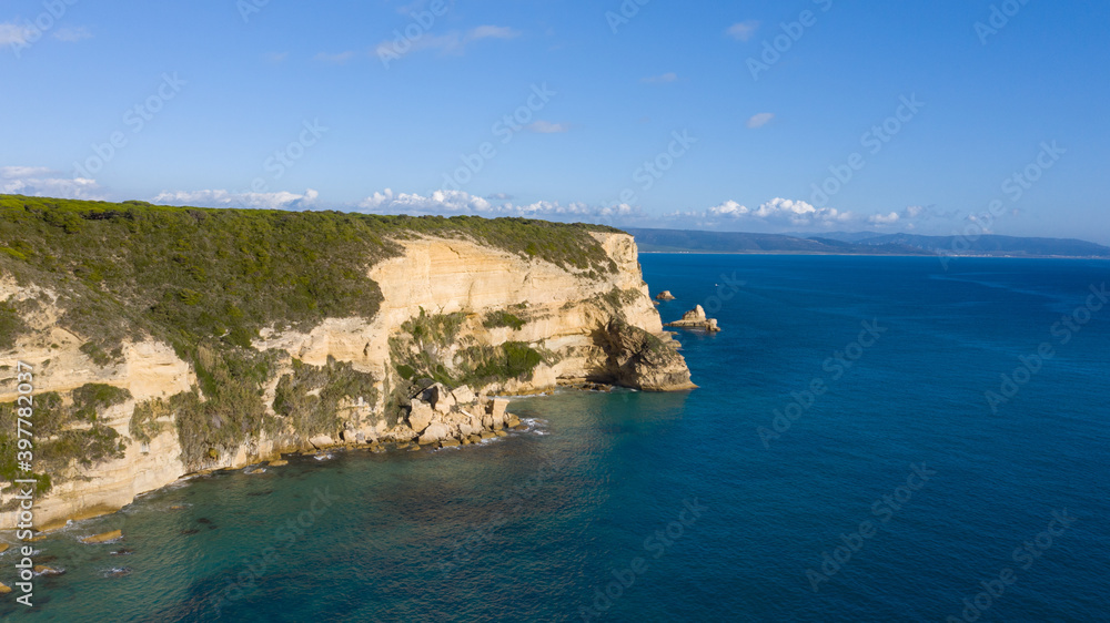 Cliffs of La Breña in Barbate seen from an aerial perspective in a quiet morning with clear Atlantic Ocean water