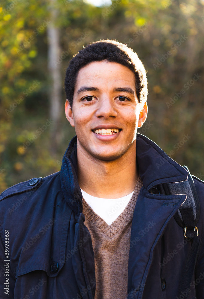 Portrait of a young man looking directly to the camera. Portrait of a young man looking directly to the camera.