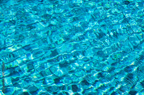 Abstract blue ripple wave and clear turquoise water surface in swimming pool,