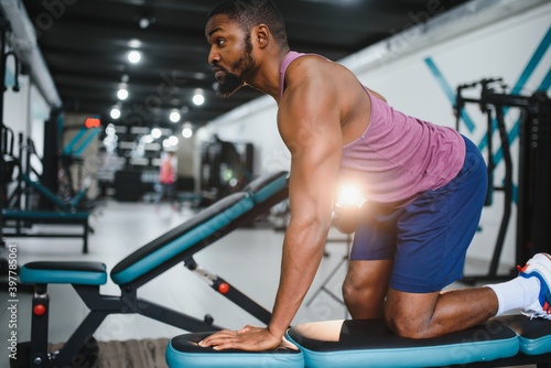 Portrait african american bodybuilder at gym intense intimidating glare expression conviction