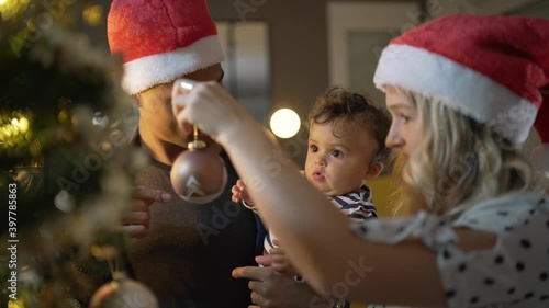 Young family of three celebrating Christmas  photo