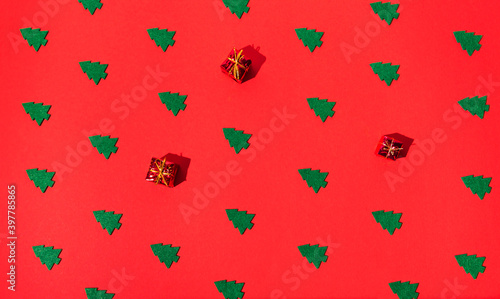 Wallpaper Mural Winter composition  of green christmas trees on red background. Torontodigital.ca